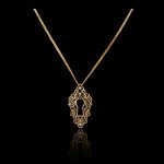 Black enamel gold pendant